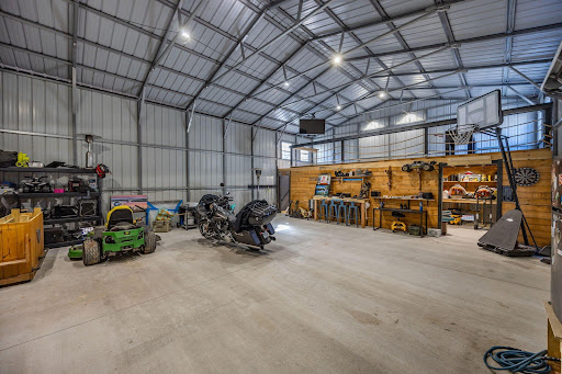 Interior of a large garage with motorcycle - House purchase in Meggett, 4 bedrooms