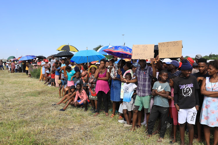 Residents of Maokeng, some holding placards demanding better service delivery, came to see President Cyril Ramaphosa at the grave site of former ANC president Zaccheus Mahabane as the party celebrates its 111th birthday in the Free State.