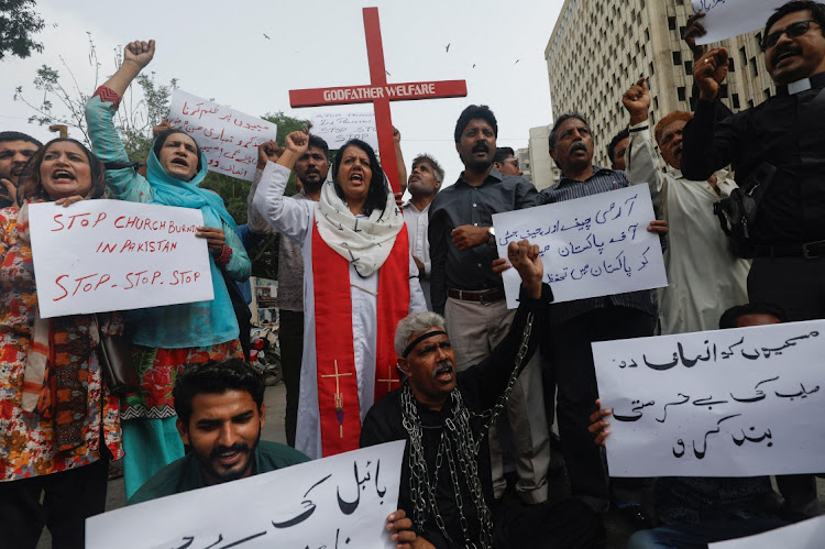 Members of the Christian community chant slogans as they hold placards to condemn the attacks on churches and houses in Jaranwala town of Faisalabad, during a protest in Karachi, Pakistan, on August 17 2023. REUTERS/AKHTAR SOOMRO