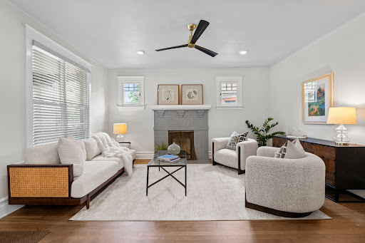 Living room with sofa, armchairs, and fireplace - Property purchase in Denver, 5 bedrooms