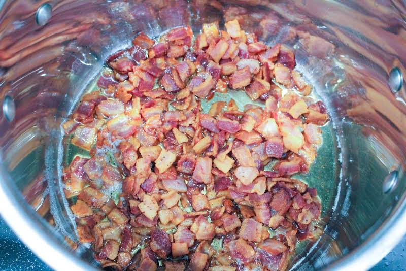 Browning Bacon In A Stock Pot.