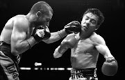 TAKE THAT: Vic Darchinyan, of Australia, left, lands a punch on Jorge Arce, of Mexico, during the third round of their IBC-WCB-WBA super flyweight title fight in in Anaheim, California, USA, Saturday. 07/02/09. Pic. Chris Carlson. © AP.