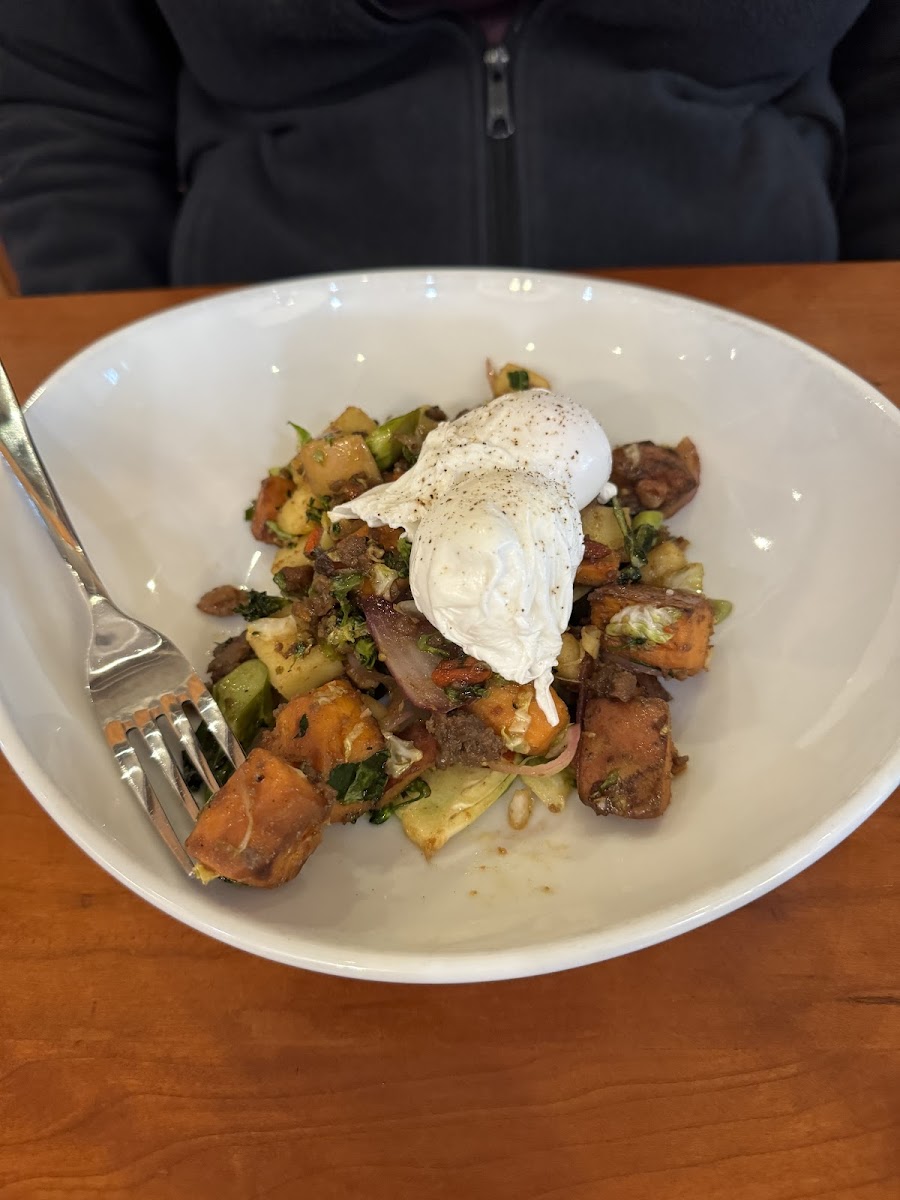 A sweet potato hash with poached eggs