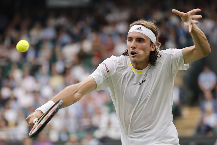 Stefanos Tsitsipas of Greece in action in the men's second round match against Jordan Thompson of Australia at the Wimbledon Championships.