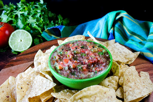 A bowl of 5 Minute Salsa with tortilla chips.