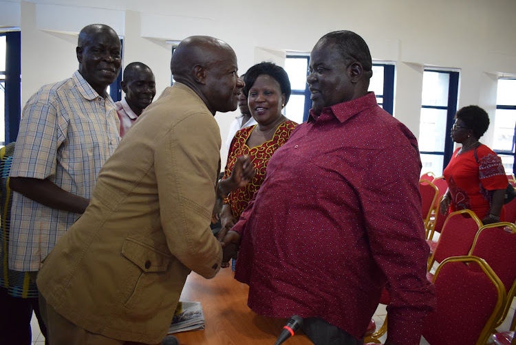 Homa Bay governor Cyprian Awiti greets North Karachuonyo MCA Paul Wamunga as his collegues look on after the governor met revenue officers in Homa Bay town on January 11,2020