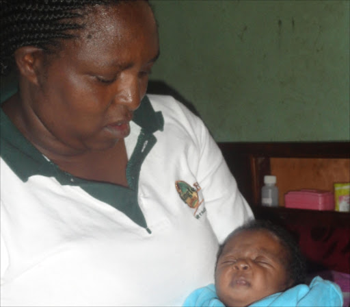 Grace Njeri with her newborn child Irene Nyambura at their home in Makongeni, Thika