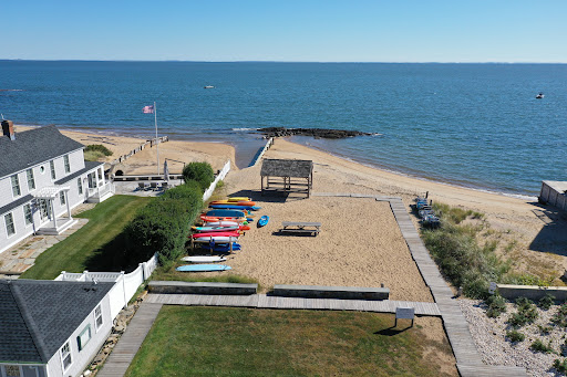 House and beach with kayaks and sailboats in this luxury property for rent in Madison ($2,400)