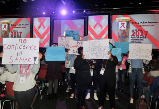 Members of civil society organisations protest against the South African National AIDS Council (SANAC) during the opening of the South African AIDS Conference.