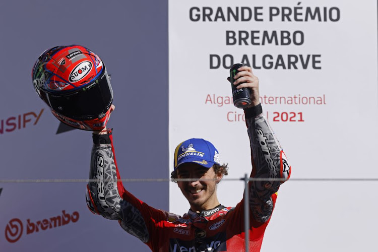 Ducati Lenovo Team's Francesco Bagnaia celebrates on the podium after winning the Algarve Grand Prix