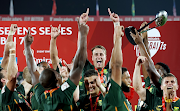 The Blitzboks celebrate victory in the men's cup final against Ireland on day 2 of the HSBC World Rugby Sevens Series - Dubai in Dubai, United Arab Emirates on December 3 2022.