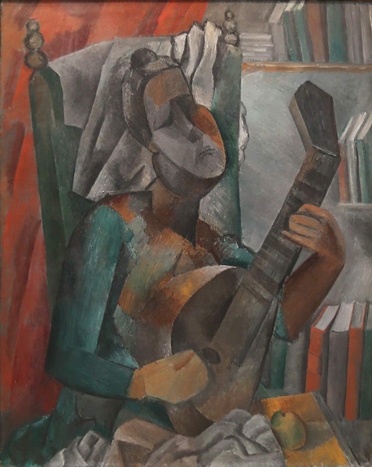  Pablo Picasso, “Woman Playing a Mandolin,” 1909, oil on canvas, at the Hermitage at St. Petersburg, Russia. 