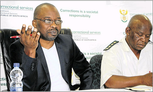 Minister of Justice and Correctional Services Michael Masutha, left, visited the Mdantsane Prison yesterday following the daring escape of four dangerous prisoners on Wednesday. Next to Masutha is Eastern Cape Correctional Services commissioner Nkosinathi Breakfast Picture: MALIBONGWE DAYIMANI