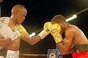 Malcolm Klassen connects  with a left during his  super- featherweight bout  against Justin Savi  at Emperors Palace.