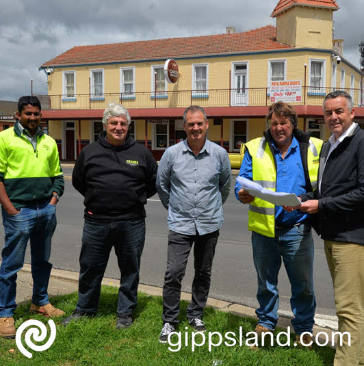 From the left, Vid Gamage and Chris Settle from Cranes Asphalting (contractors for the central section), Wellington Shire Council Mayor Ian Bye, Wayne Volk from JW Volk P/L (contractors for the northern and southern sections) and Federal Member for Gippsland Darren Chester check out plans for the revitalisation project at the intersection of York Street and Cunninghame Street, Sale