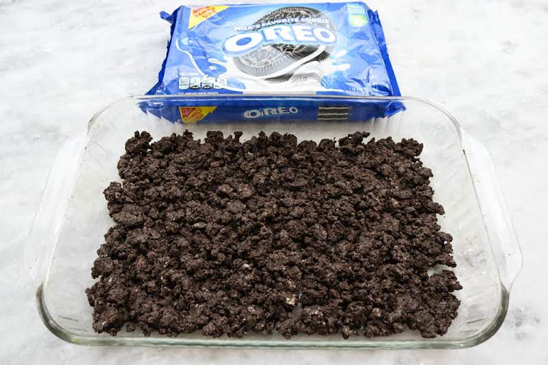 Combine Crumbled Chocolate Sandwich Cookies And Softened Butter. Pat Into A Baking Dish.