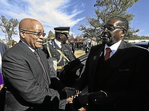Former presidents Jacob Zuma and Robert Mugabe meet at Fort Hare University in 2016. Picture: Siyabulela Duda