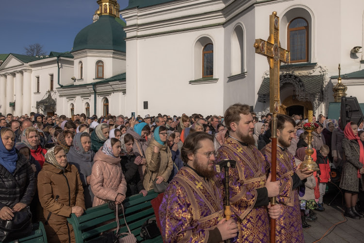 People attend the Sunday service of the Ukrainian Orthodox Church at a compound in Kyiv, Ukraine, March 26 2023. Picture: ROMAN PILIPEY/GETTY IMAGES