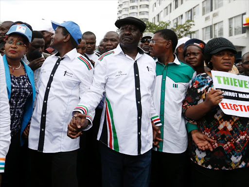 Cord co-principal Kalonzo Musyoka, leader Raila Odinga, co-principal Moses Wetang’ula and nominated Senator Elizabeth Ongoro march to the IEBC office at Anniversary Towers, Nairobi, on May 9 /JACK OWUOR