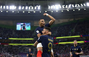 France's Olivier Giroud celebrates scoring their first goal with teammate Kylian Mbappe in their World Cup last-16 win against Poland at Al Thumama Stadium in Doha, Qatar on December 4 2022.