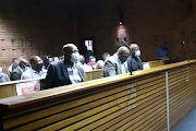 The three accused in the Pretoria magistrate's court. One of the accused, Hawks serious corruption investigation commander Lt-Col Ayanda Plaatje, has since died. File photo. 