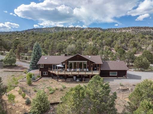 Wooden house with large wooden balcony in this luxury house for sale in Ridgway ($2,349,000)