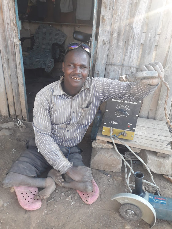 Nicholas Kibet works at motorcycle repair station in Sigor, Chepalungu, in Bomet county, but does not have proper mobility products.