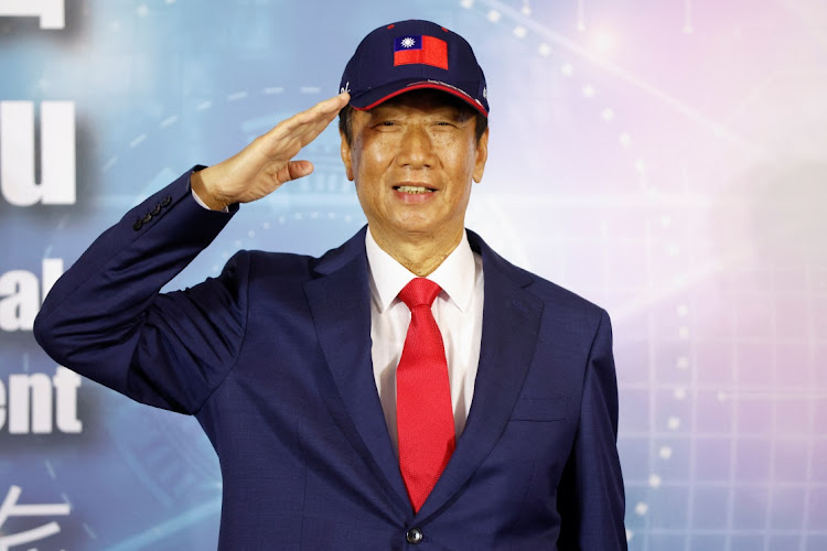 Terry Gou, founder of Taiwan's Foxconn poses for pictures while saluting during a news conference in Taoyuan, Taiwan April 5 2023. REUTERS