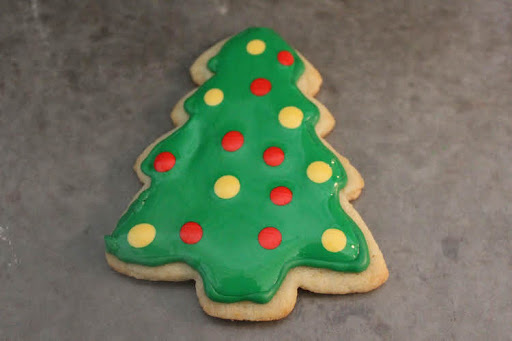 Green cookie tree decorated with royal icing for Christmas