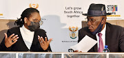 Minister of state security Ayanda Dlodlo and police minister General Bheki Cele at a media briefing on the containment of unrest in KZN and Gauteng in July 2021.