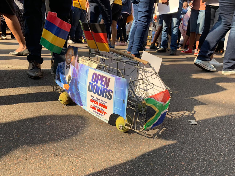 A creative Bushiri supporter with a wire taxi 'draad kar'.