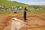 Teboho Mashinini busy rebuilding his shack yesterday.  Vaal Marina settlement in  Midvaal was on Monday battered by a tornado which left about 50 people injured and about 300 homeless. / Thulani Mbele