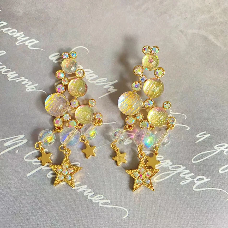 Elegantes pendientes de borlas de longitud media, diseño translúcido y dulce Starlight, perfectos para cualquier ocasión especial.