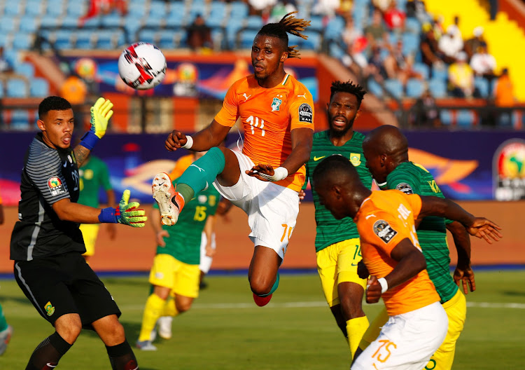 Ivory Coast's Jonathan Kodjia in action against South Africa goalkeeper Ronwen Williams during their Africa Cup of Nations match at Al Salam Stadium, Cairo, Egypt, June 24, 2019