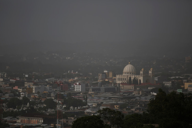 Downtown San Salvador buildings are seen as dust carried by winds from the Sahara desert shrouds city, in El Salvador on June 25, 2020.