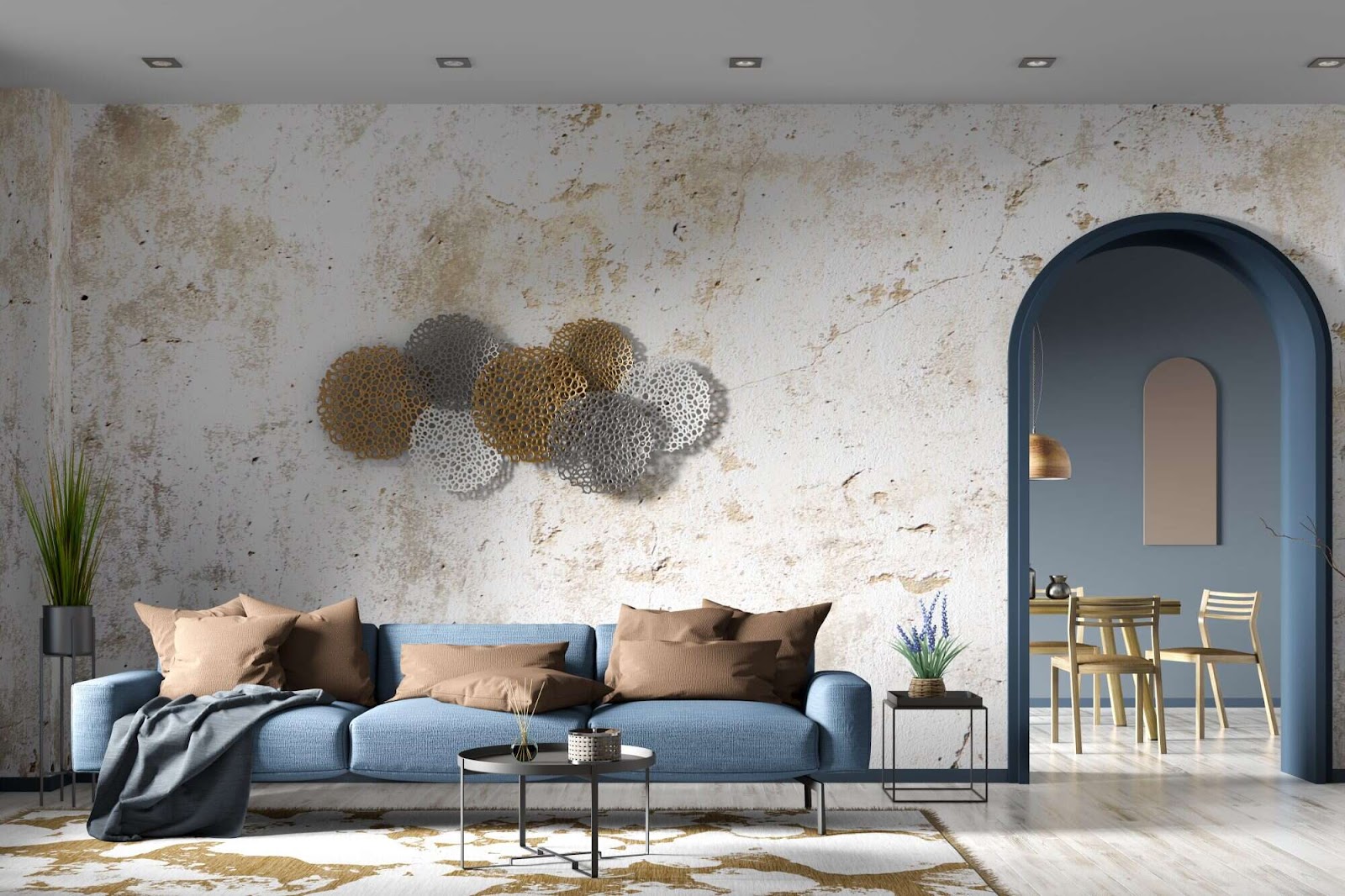Modern interior of living room with blue sofa, concrete stucco wall with arch door