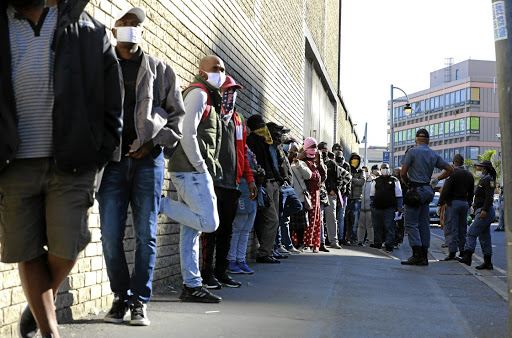 People are queuing outside the department of labour to apply for UIF benefits. /Nardus Engelbrecht / Gallo Images