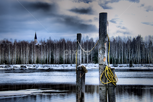 Spring by the river by Jon Eggen -   ( fetsund lenser, wires, spring, fetsund, poles, church, akershus, norway, early spring, ice, water, norge )