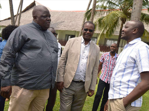 Kileleshwa MCA Elias Okumu, Nairobi Governor Evans Kidero and Waithaka MCA Anthony Kiragu during a workshop on county bills and motions at Voyager Hotel in Mombasa yesterday / JOHN CHESOLI