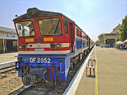 A new, Chinese-made locomotive pulls the ageing rolling stock into Bagan station.