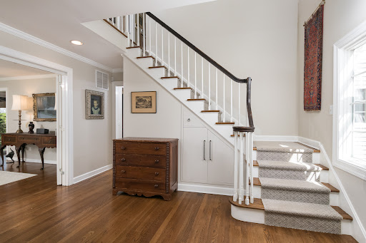 Entrance with staircase, dresser, and painting - Buy this luxury property in Princeton, 4 bedrooms
