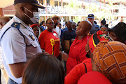 Police and EFF members exchange heated words at Grosvenor Girls High School.