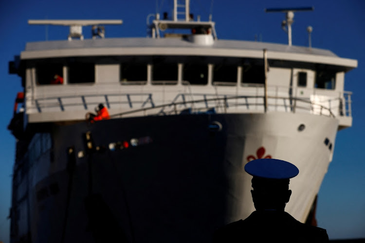 A member of the port authorities looks on as a ferry arrives at Giglio island, Italy, on January 13 2022, the 10th anniversary of the Costa Concordia shipwreck. Picture: REUTERS/YARA NARDI