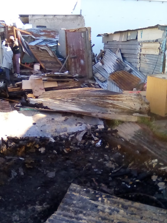 All gutted remains of shacks destroyed by a fire that ravaged Nompumelelo