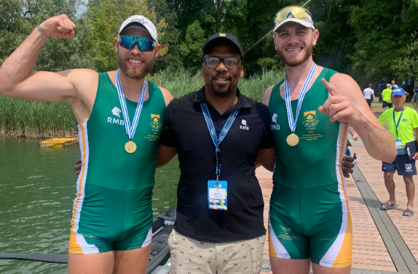 Rowers Damien Bonhage-Koen and Christopher Baxter celebrate their under-23 world championship gold in the men's pair in Italy.