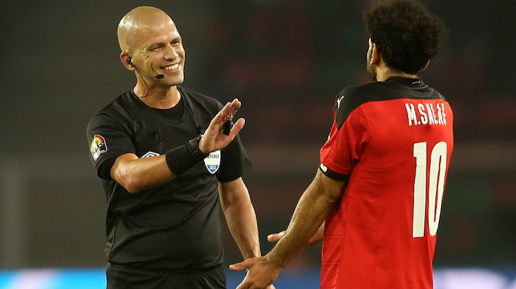 Referee Victor Gomes waves away the protests of Egypt captain Mohamed Salah during the 2021 Africa Cup of Nations final against Senegal at Olembe Stadium in Yaounde, Cameroon, on February 6 2022.