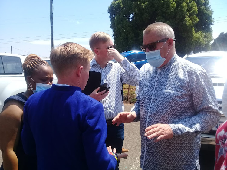 Mayor elect Chris Pappas speaks to DA provincial leader Francois Rodgers outside the Howick community hall where the inauguration was set to take place on Friday morning.