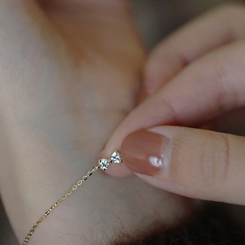 S925 Sterling zilveren strikarmband met hartvormige zirkonia, 14K goud verguld. Een elegant sieraad, perfect als cadeau.