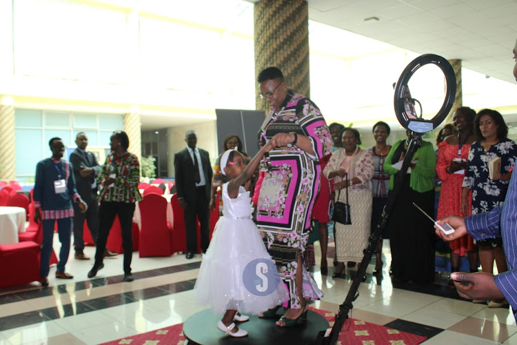 Public Service, Gender and Affirmative Action Cabinet Secretary Aisha Jumwa dancing with Jasmine Njeri on a booth 360 during the launch of the 2023 CRAWN Trust Annual Women's Rights convention at Panari hotel on August 23, 2023