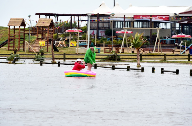 Flooding in Summestrand turned out to be the perfect time for Edward Gibbons and Abigale Abrahamson to test their boating skills.